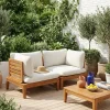 Modulare Gartenbank aus Akazienholz mit Seitenteilen und Bezug mit Bouclé-Look